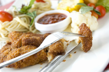 piece of fried chicken on fork