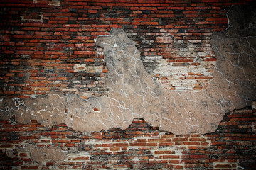 Cracked concrete and grunge brick wall