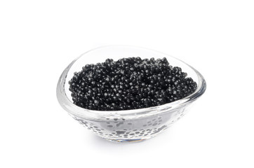 Fototapeta na wymiar black caviar in a glass bowl isolated on a white background