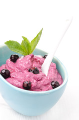 blackcurrant mousse with cream cheese, decorated mint, close-up