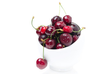bowl of fresh cherries on a white background isolated