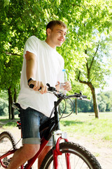 Obraz premium Young men with a bottle