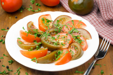 salad of two varieties of tomatoes with fresh parsley