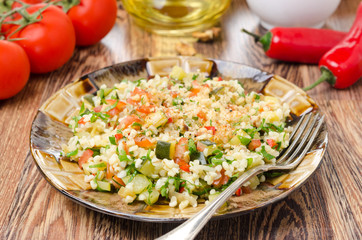 salad with bulgur, zucchini, tomatoes and parsley