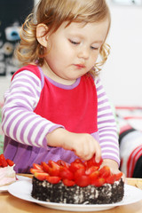 Girl and strawberry cake