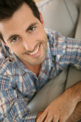 Obraz premium Portrait of handsome guy relaxing at home