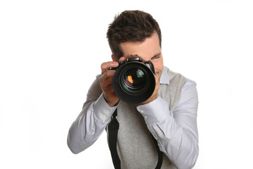 Portrait of photographer holding digital camera