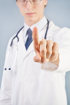 Doctor pushing button or pointing