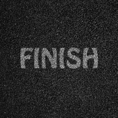 Asphalt close up with the word finish write on white