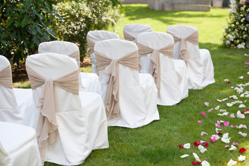 wedding chairs with the white covers