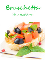 Classic Italian appetizer bruschetta with tomato, basil and blac