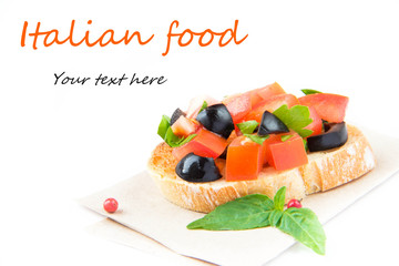 Classic Italian appetizer bruschetta with tomato, basil and blac
