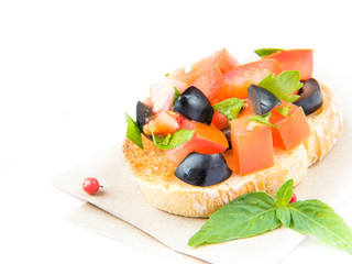 Classic Italian appetizer bruschetta with tomato, basil and blac