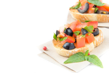 Classic Italian appetizer bruschetta with tomato, basil and blac