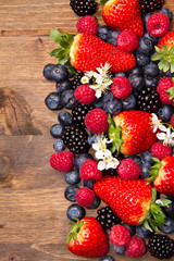 Berries on Wooden Background