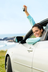 Woman on car travel with keys