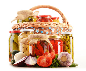 Composition with jars of pickled vegetables. Marinated food