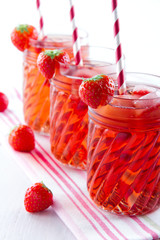 Red strawberry juice with frozen icecubes