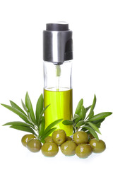 bottle of olive oil with olives and olive's leaves