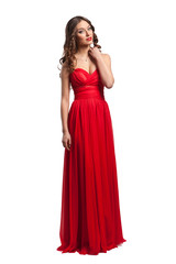 Fototapeta premium Beautiful female fashion model posing in red dress