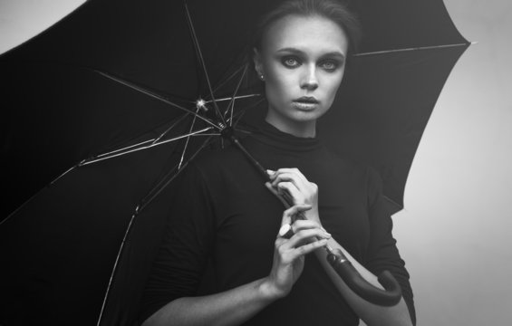 Beautiful girl portrait with umbrella outdoor