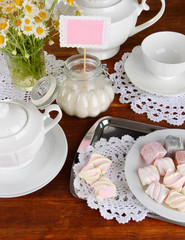 Table setting with chamomiles on wooden table
