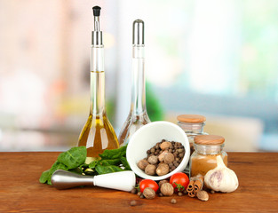 Composition of mortar, bottles with olive oil and vinegar, and