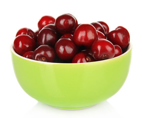Cherry berries in bowl isolated on white