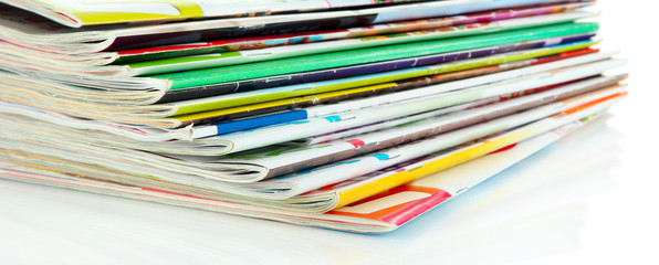 Many magazines isolated on white