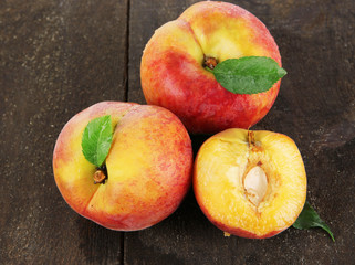 Peaches on wooden table