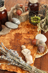 Composition with old papers, herbs, stones and bottles with