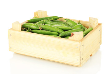 Sweet green peas in wooden box isolated on white