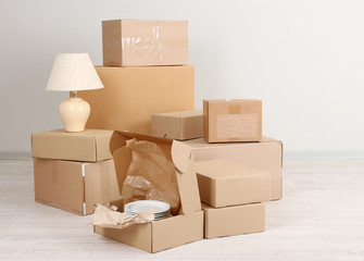 Moving boxes on the floor in empty room