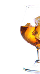 Brandy glass with ice isolated on white