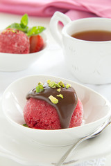 Strawberry sorbet with chocolate and pistachios.