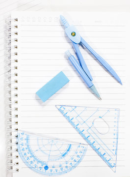 School supply set isolated on notebook