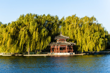 Chinese pavilion surrounded by the tree and lake
