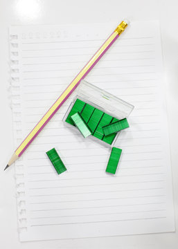 Green max stapler and pencil  on note