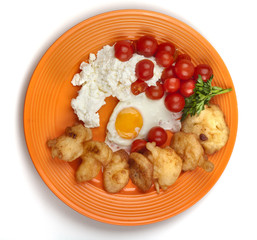 Breakfast with eggs and cheese and tomatoes