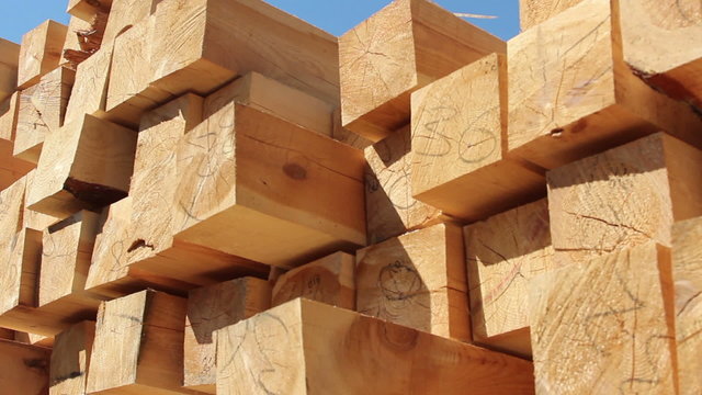 Stack of square wooden chips at construction yard. 