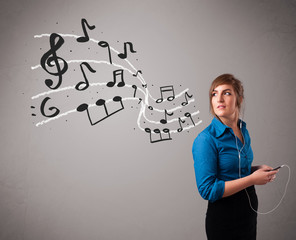 attractive young lady singing and listening to music with musica