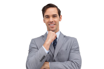 Smiling young businessman looking at the camera