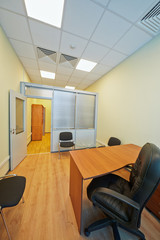 Empty office cabinet with open door