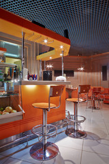 Fototapeta na wymiar Empty cafe-bar in orange tones