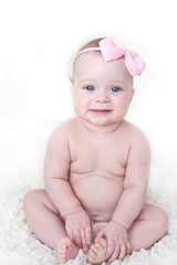 Little beautiful blue-eyed baby girl