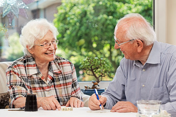 Senior couple playing Yahtzee