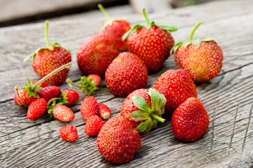 Ripe strawberry on wooden table