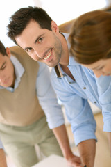 Smiling handsome man working in office