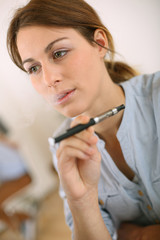 Portrait of woman smoking with electronic cigarette