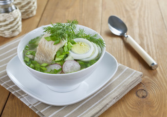 Vegetable soup with sorrel and boiled fish